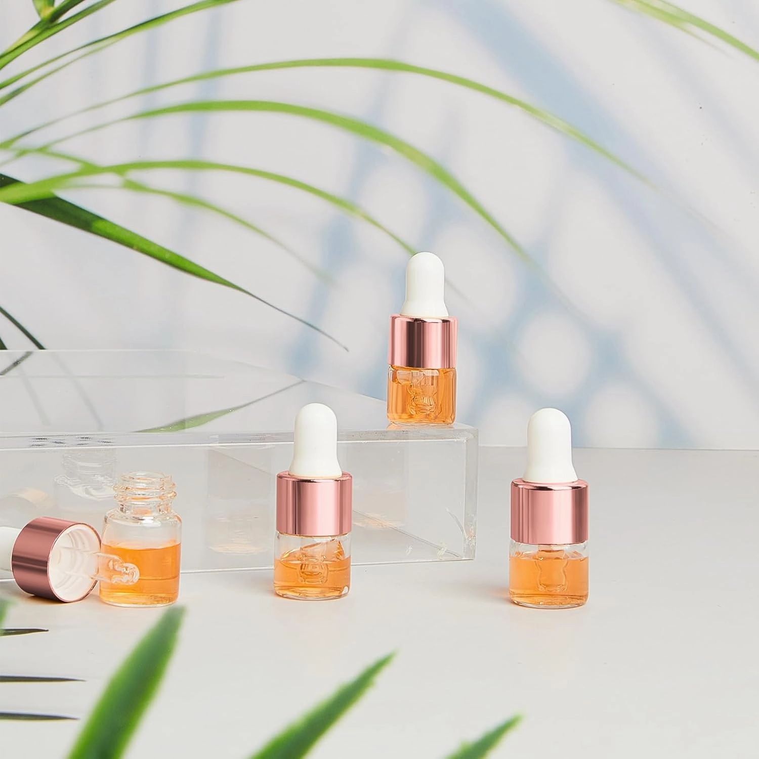 100 Pcs Mini Glass Oil Dropper Bottle Bulk, 1 ml Rose Gold Clear Essential Small Empty Bottles Sample Containers Perfume Liquid Vials with Cap for Traveling